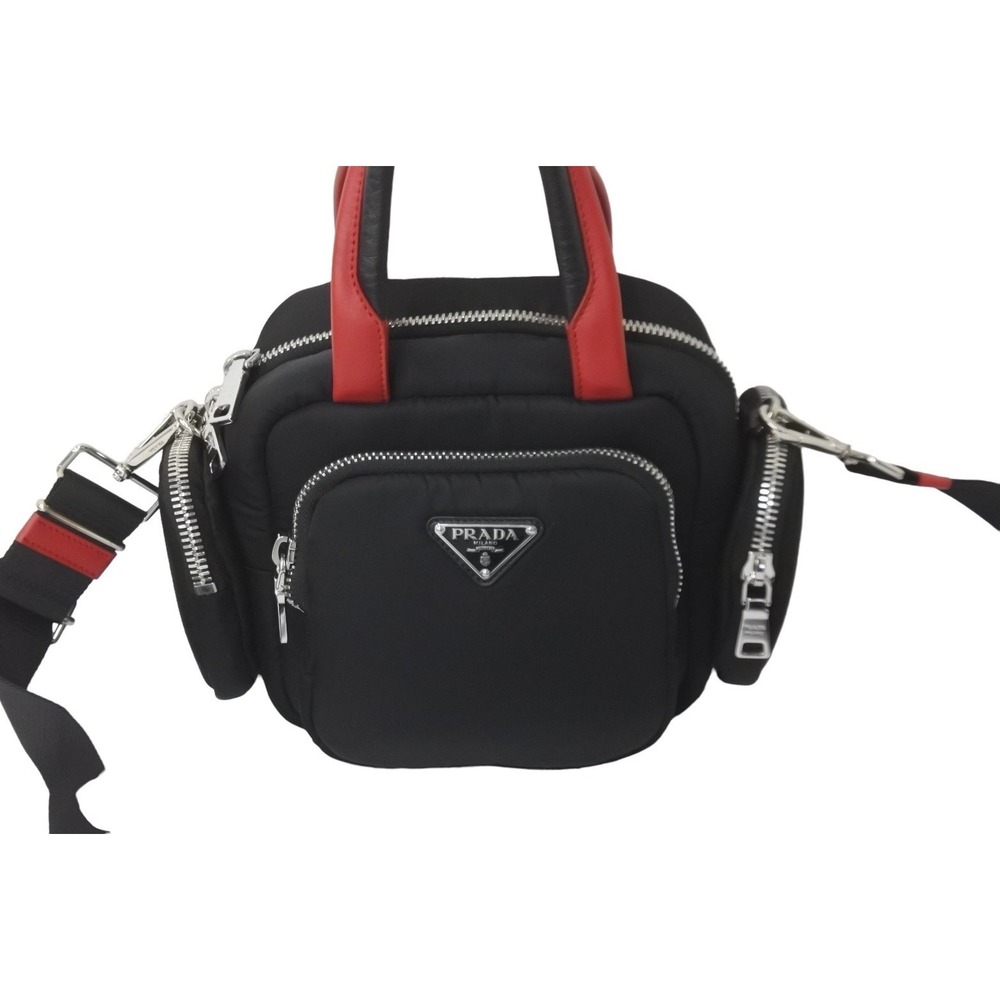 Prada black leather red handbag triangular plate logo